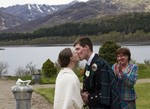 Kissing the bride at Ardverikie Estate wedding
