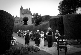 Marriage ceremony on the lawn at Guthrie Castle, Forfar