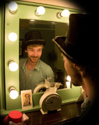Bearded guy in top hat looking in mirror