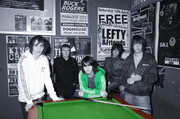 Pop group at snooker table
